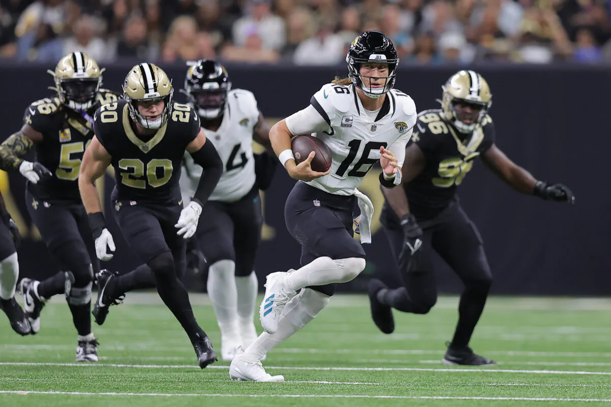 Trevor Lawrence (16) of the Jacksonville Jaguars runs with the ball during the first half against the New Orleans Saints in New Orleans on Oct. 19, 2023. (Jonathan Bachman/Getty Images)