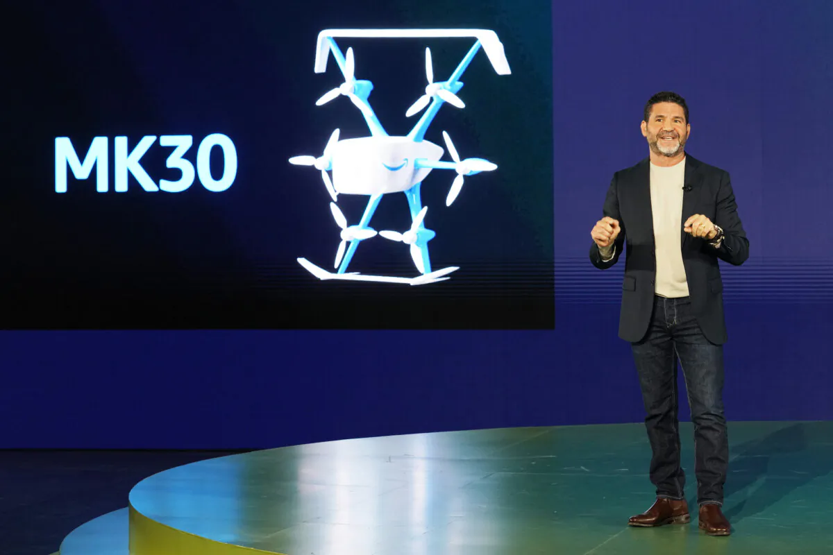 A supplied image shows Amazon Prime Air vice-president David Carbon talking about the company’s Mark 30 drone at Amazon BFI1 testing facility in Seattle, Washington, United States, Oct. 19, 2023. Amazon has revealed plans to launch drone deliveries in more US cities and in the UK and Italy next year. (AAP Image/Supplied by Amazon)