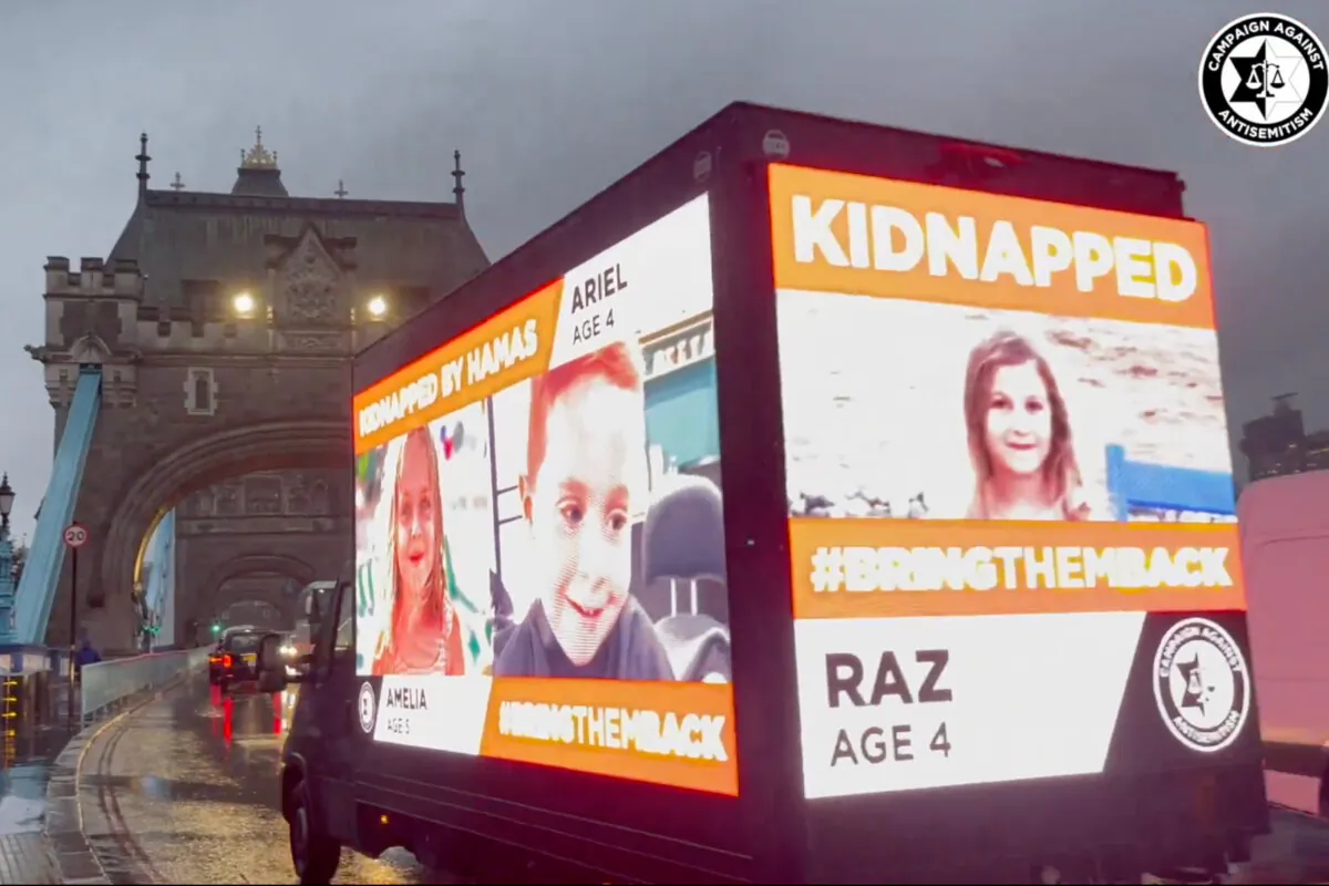 Screenshot taken with permission from a video posted on X by Campaign Against Antisemitism showing a billboard van displaying information of children taken hostage by the Hamas terrorist group moving through central London on Oct. 18, 2023. (Campaign Against Antisemitism/Screenshot via The Epoch Times)