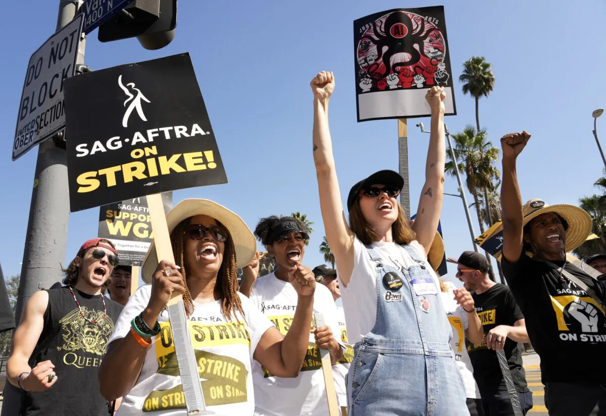 Striking actors Jennifer Leigh Warren (L) and Emily Kincaid (R) demonstrate outside Netflix studios in Los Angeles on Oct. 17, 2023. (Chris Pizzello/AP Photo)