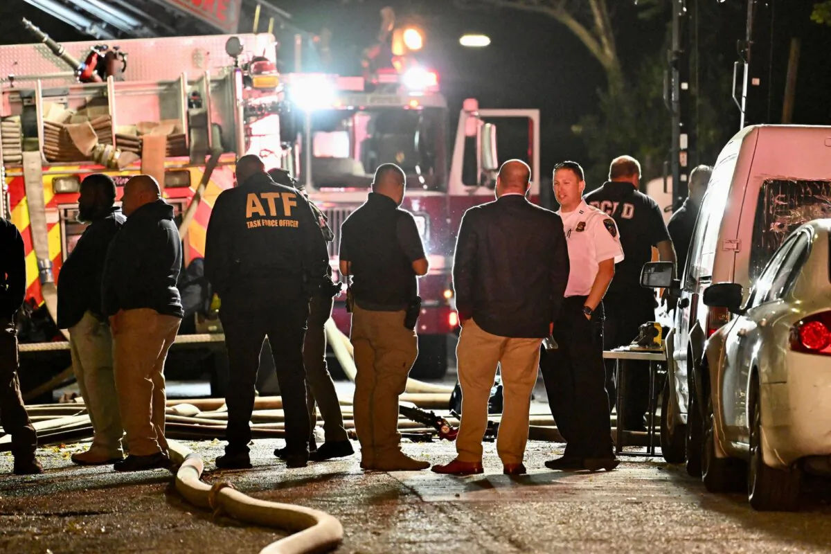First responders work the scene after a deadly fire, in Baltimore, on Oct. 19, 2023. (Jerry Jackson/The Baltimore Sun via AP)