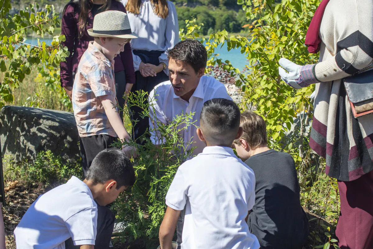 Prime Minister Justin Trudeau takes part in a tree-planting event with local youth in Milton, Ont., on Sept. 2, 2022. (The Canadian Press/Eduardo Lima)