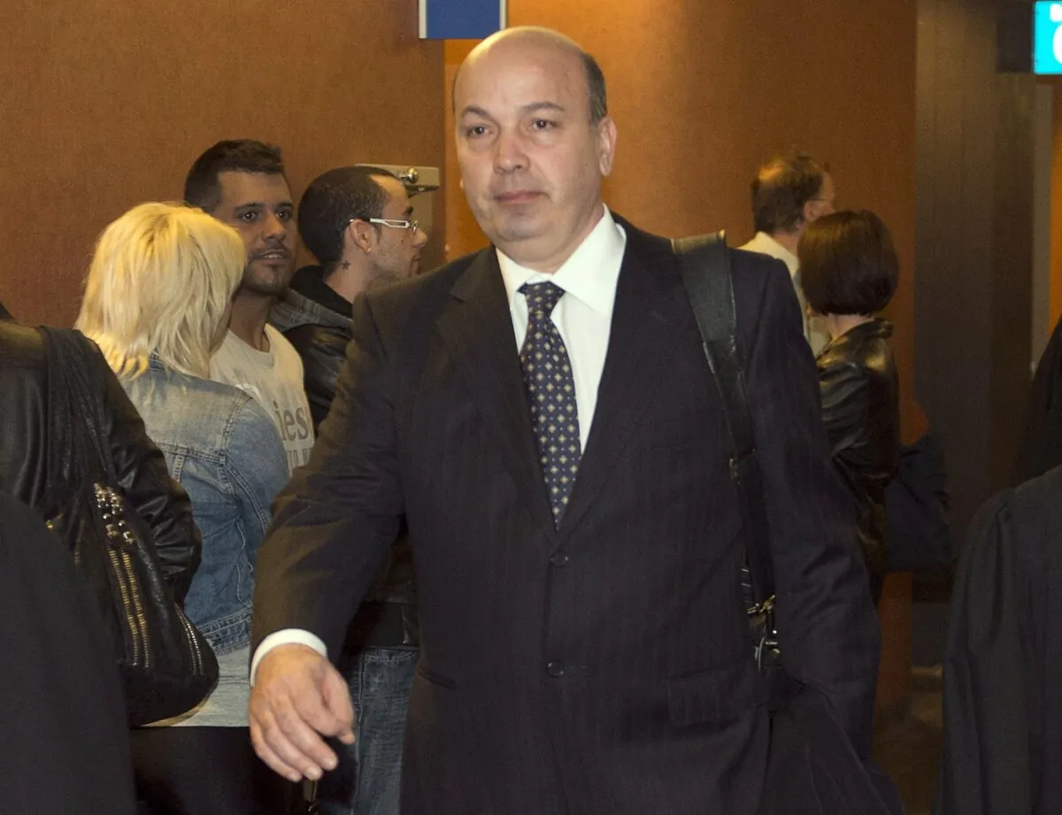 Frank Zampino, former chairman of the city of Montreal executive committee, leaves the courtroom after a brief appearance to set a trial date on fraud charges, in Montreal, on April 29, 2013. (The Canadian Press/Ryan Remiorz)