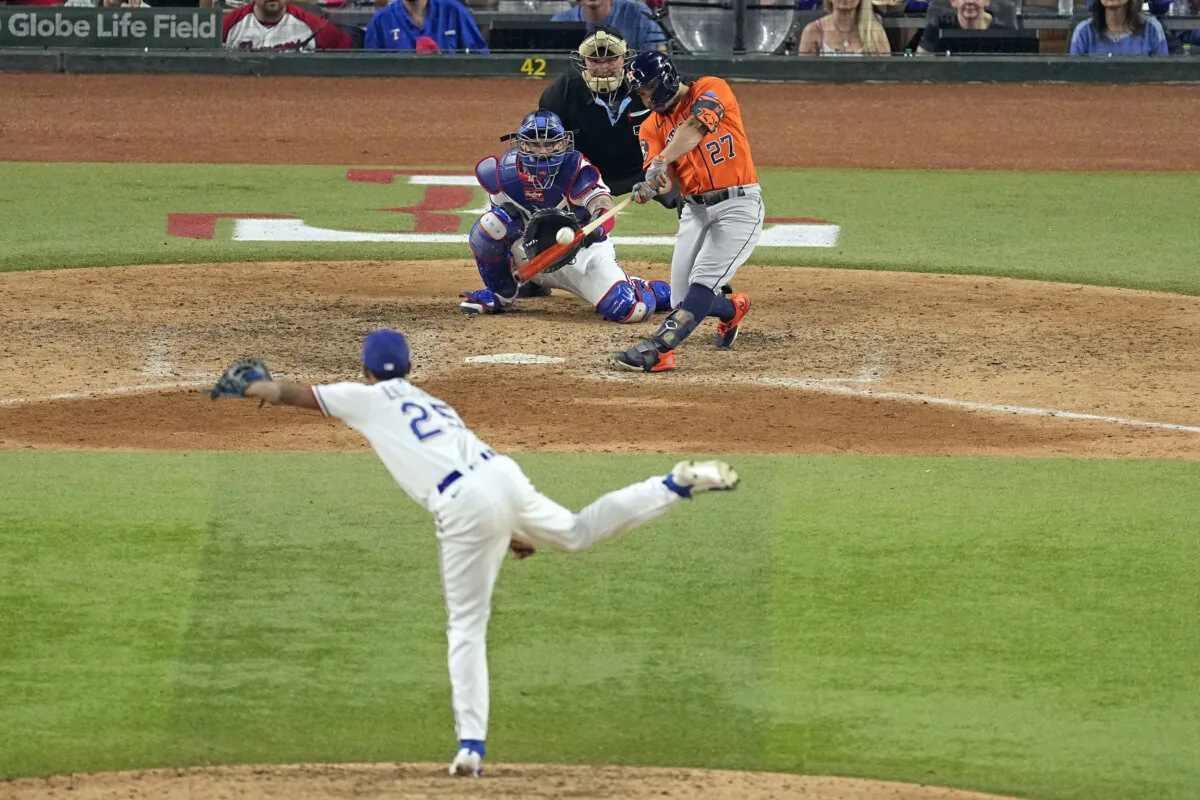 Houston Astros' Jose Altuve (27) hits a three-run home run off Texas Rangers relief pitcher Jose Leclerc (25) during the ninth inning in Game 5 of the baseball American League Championship Series in Arlington, Texas, Oct. 20, 2023. (Tony Gutierrez/AP Photo)