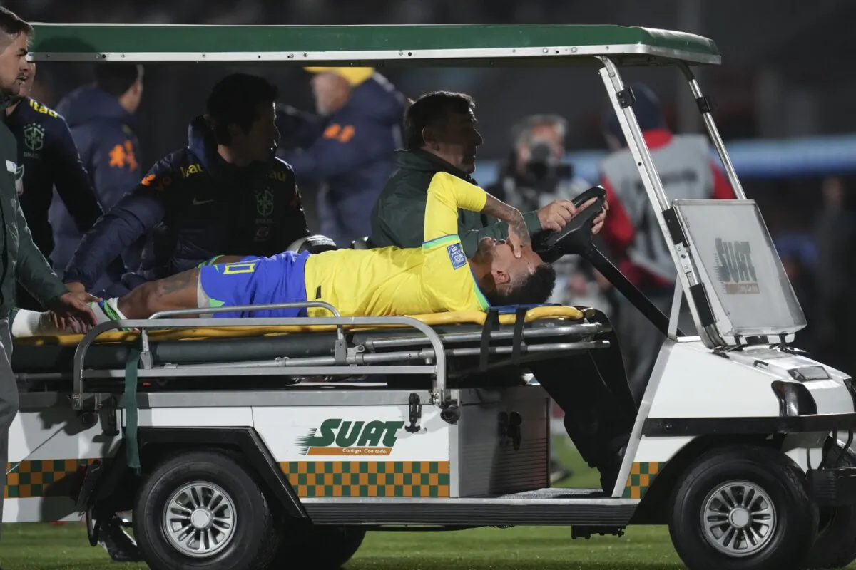 Brazil's Neymar is carried off the pitch on a stretcher after being injured during a qualifying soccer match for the FIFA World Cup 2026 against Uruguay at Centenario stadium in Montevideo, Uruguay, on Oct. 17, 2023. (AP Photo/Matilde Campodonico)