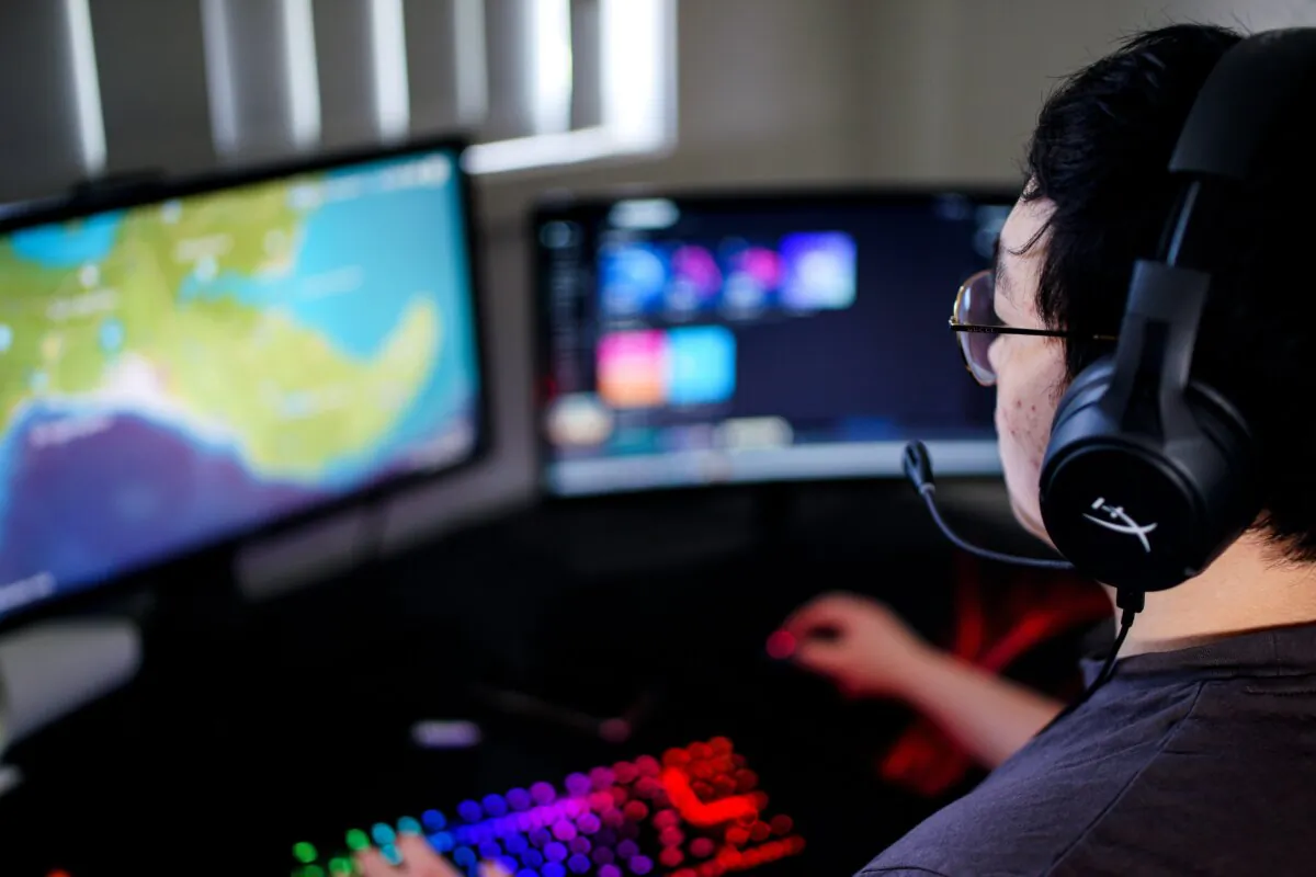A professional gamer play video games at his home in Sydney, Australia, on Nov. 13, 2020. (Andrew Lesson/AFP via Getty Images)