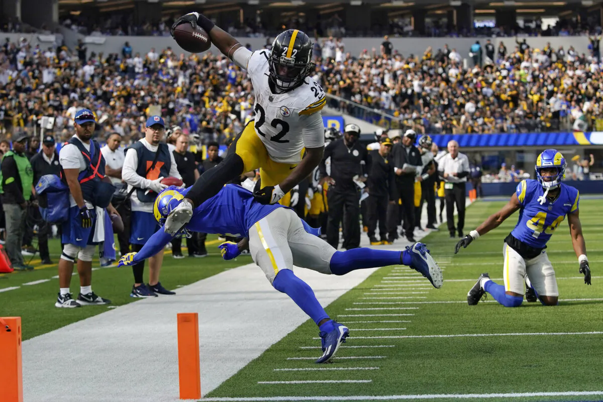 Pittsburgh Steelers running back Najee Harris, top, jumps over Los Angeles Rams safety Jordan Fuller during the second half of an NFL football game in Inglewood, Calif., on Oct. 22, 2023. (Gregory Bull/AP Photo)