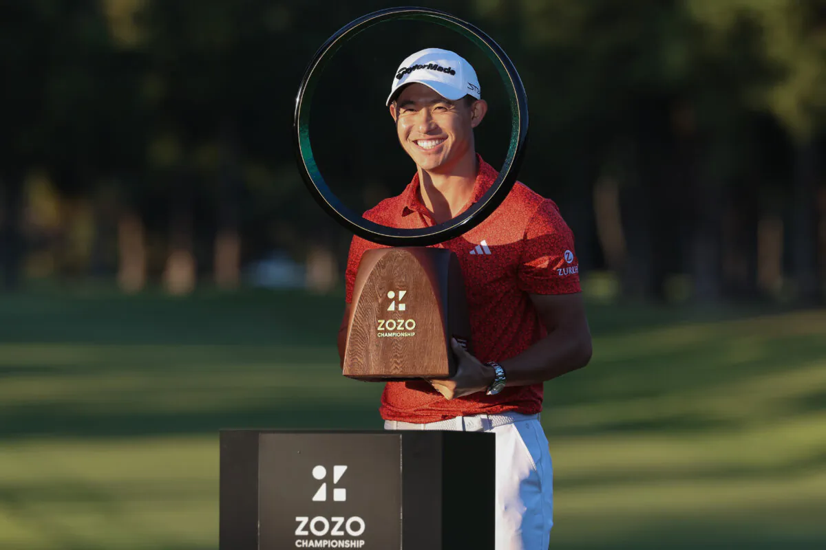 Collin Morikawa of the United States poses with the trophy after winning the tournament folloiwng the final round of ZOZO Championship in Inzai, Chiba, Japan, on Oct. 22, 2023. (Lintao Zhang/Getty Images)