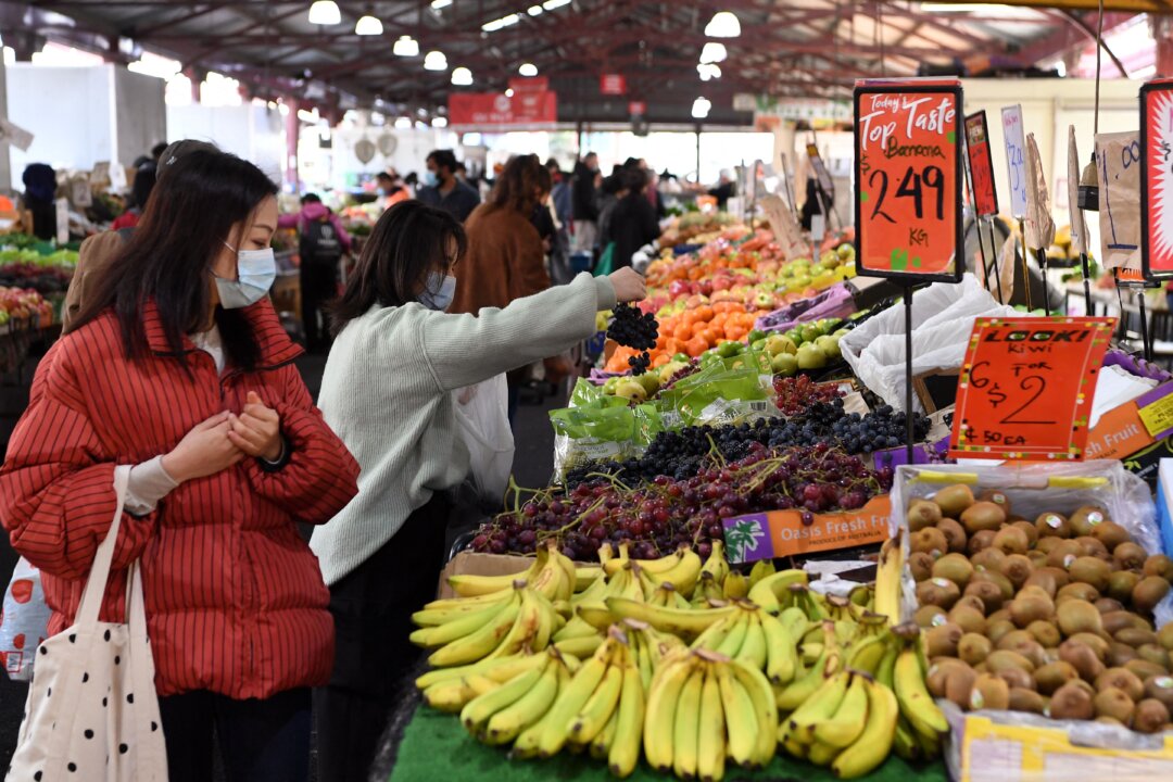 People shop for fruit and vegetables at a market in Melbourne, Australia, on June 11, 2021. (William West/AFP via Getty Images)