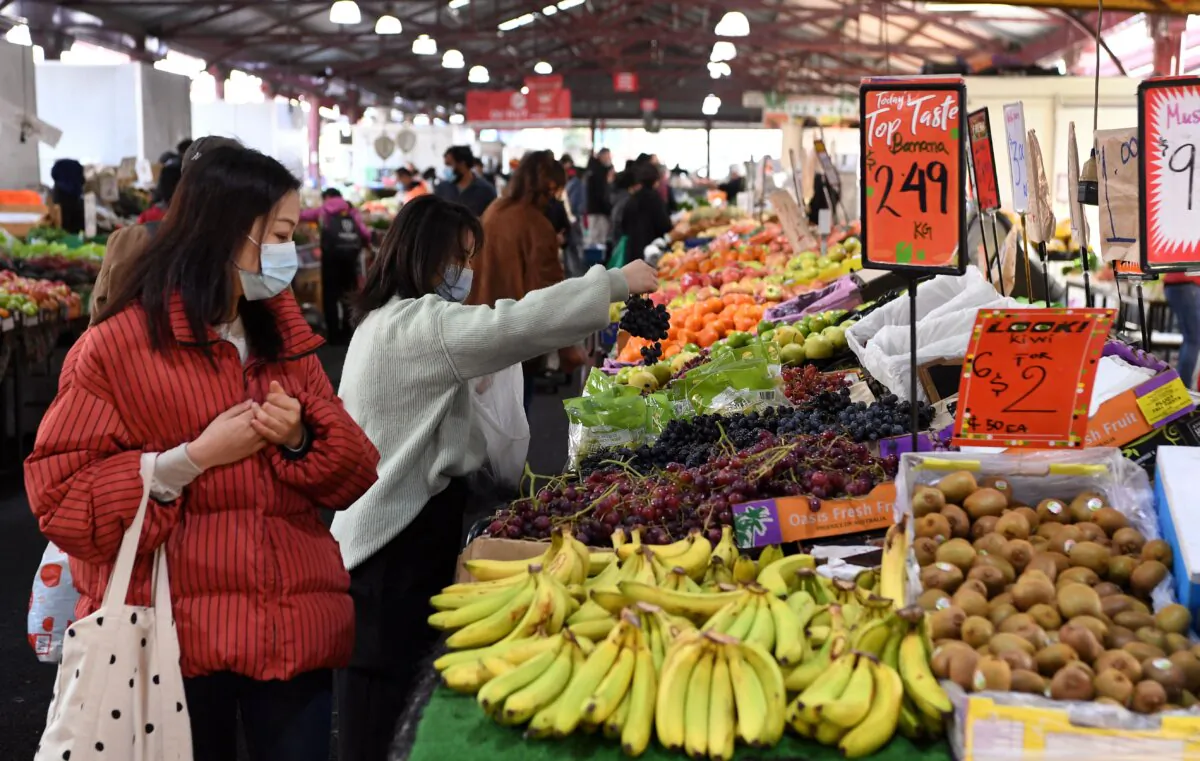 People shop for fruit and vegetables at a market in Melbourne, Australia, on June 11, 2021. (William West/AFP via Getty Images)