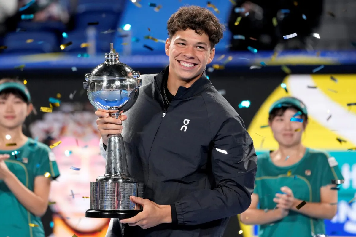 Ben Shelton of the U.S. holds the winning trophy after defeating Aslan Karatsev of Russia in the men's singles final of Japan Open tennis championships in Tokyo on Oct. 22, 2023. (Shuji Kajiyama/AP Photo)