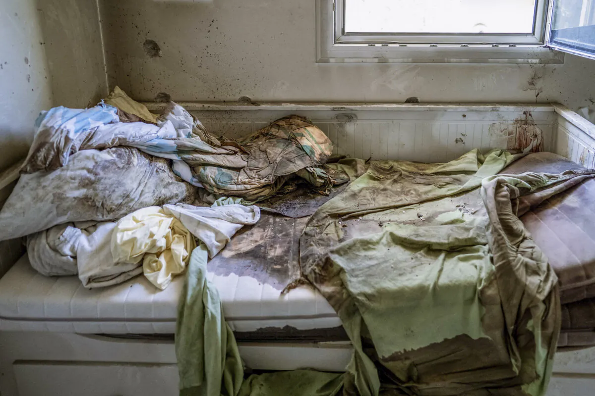 A child's bed stained with blood is among the carnage caused by Hamas terrorists after they attacked Kibbutz Be'eri, in Israel. Photo taken on Oct. 20, 2023. (Dima Vazinovich/Middle East Images/AFP via Getty Images)
