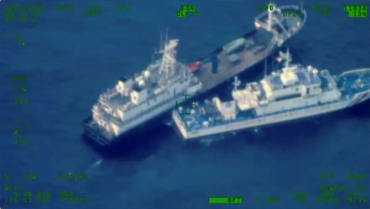 A Chinese militia vessel, top, and Philippine coast guard vessel BRP Cabra as they approach Second Thomas Shoal, locally called Ayungin Shoal, at the disputed South China Sea on Oct. 22, 2023. (Armed Forces of the Philippines via AP)