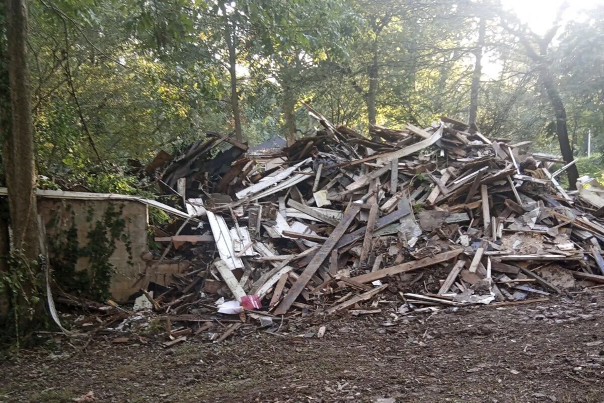 Susan Hodgson's mistakenly demolished family home sits in a pile of lumber and debris in southwest Atlanta, Ga., on Sept. 15, 2023. (Susan Hodgson via AP)