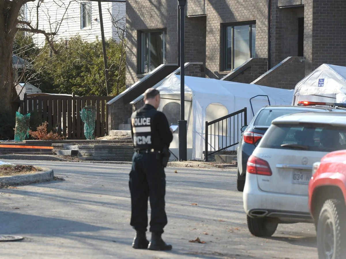 Police canvas the area outside a home after the discovery of three bodies in an east-end home on Dec.11, 2019. (The Canadian Press/Ryan Remiorz)