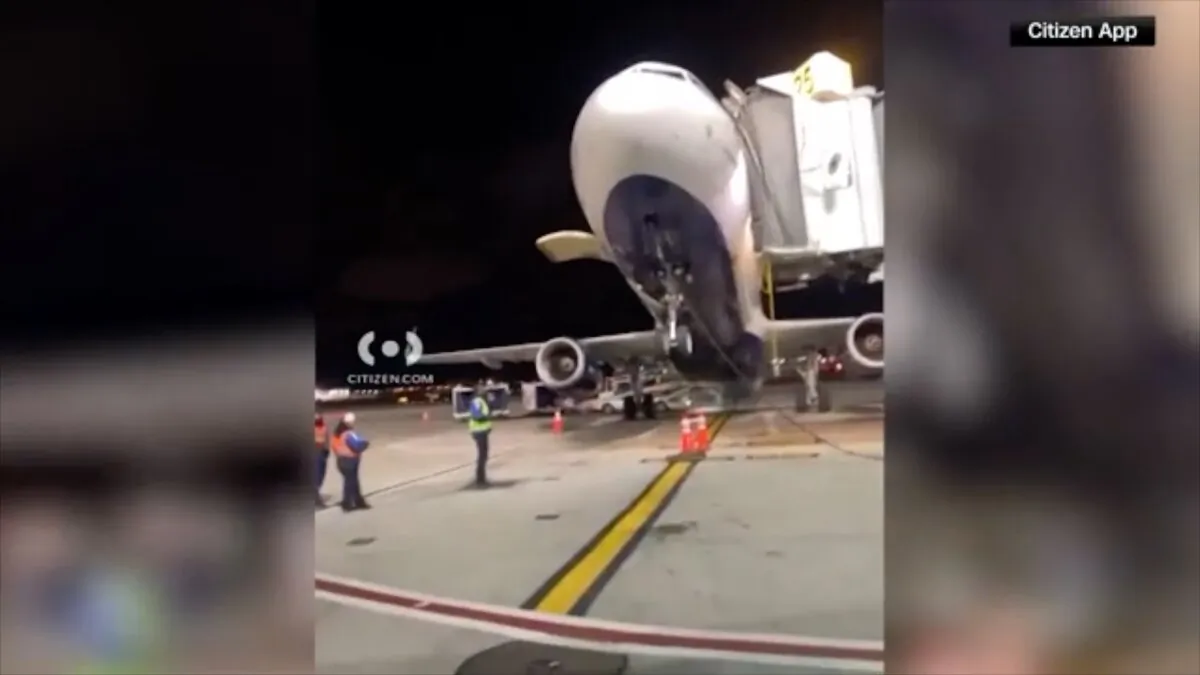 A JetBlue airplane tips up at the JFK Airport in New York on Oct. 22, 2023. (CNN/Screenshot via NTD)