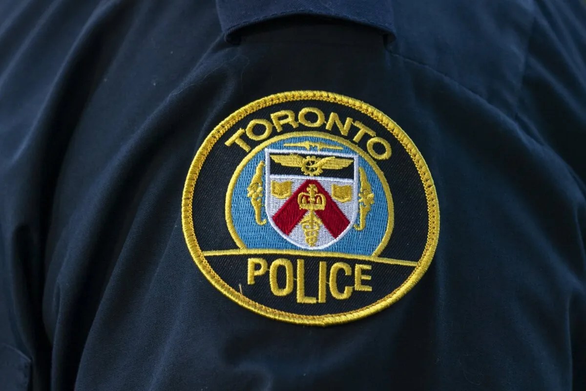 A patch showing the Toronto Police Service logo is seen on a police uniform in Toronto on Sept. 5, 2023. (The Canadian Press/Spencer Colby)