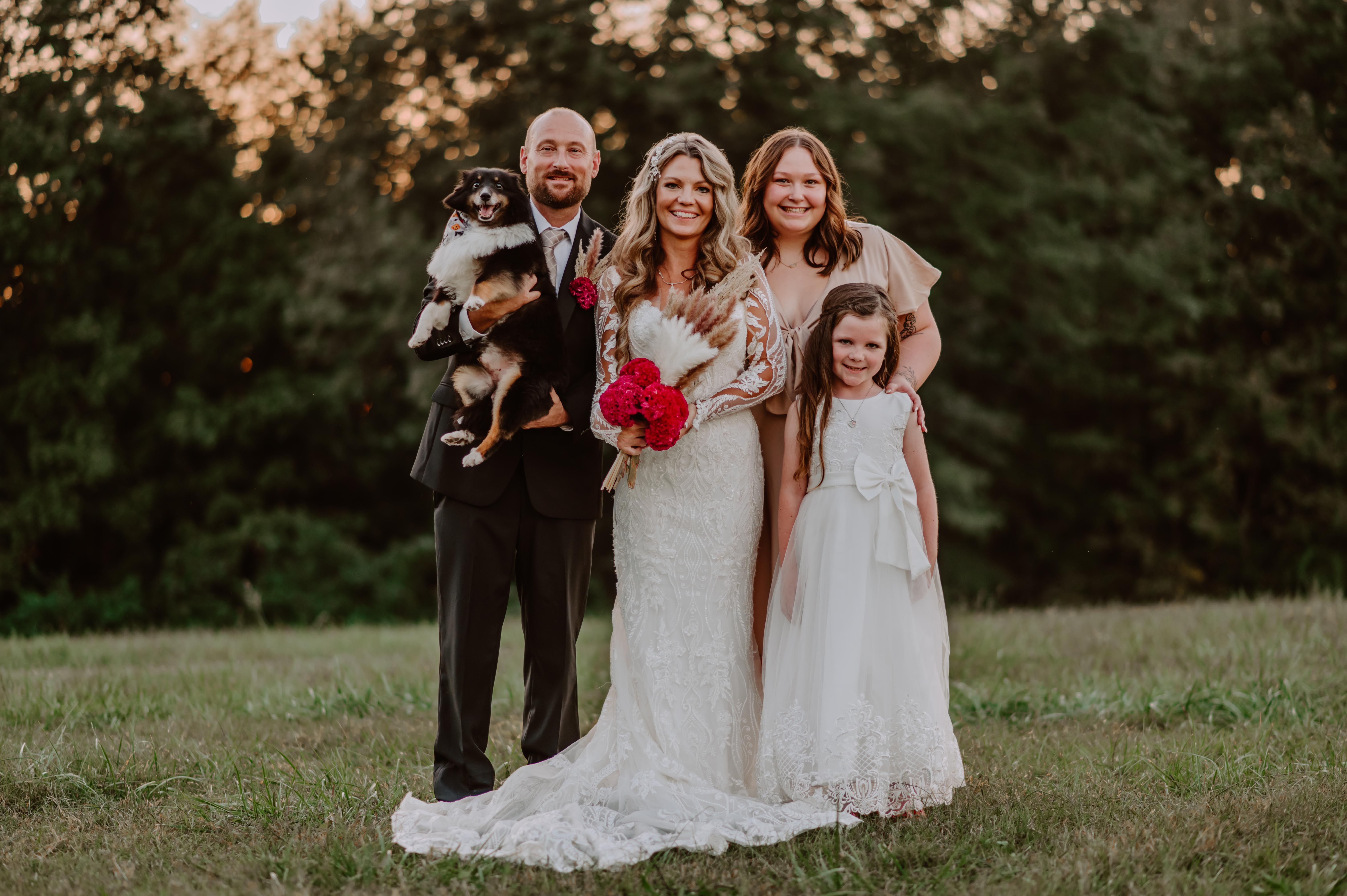 Mr. and Ms. Woodard with their daughters at the wedding. 