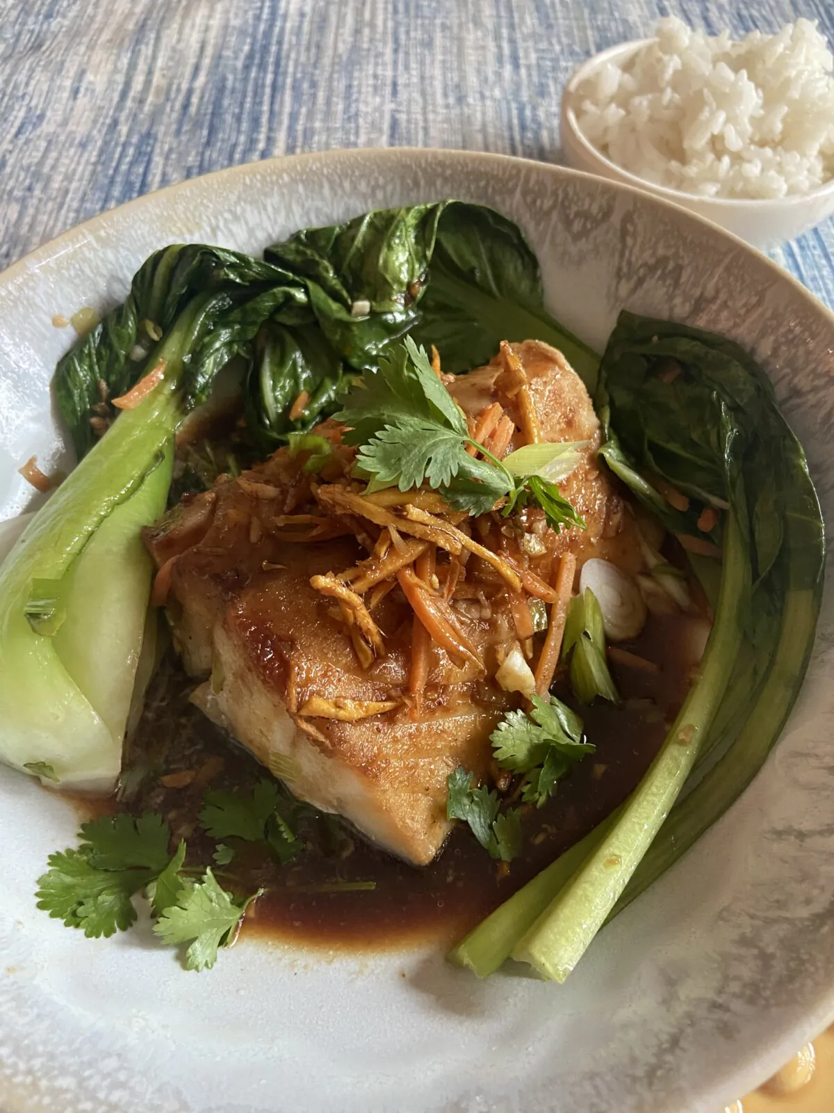 Steamed fish and stir-fried vegetables come together in a delectable dish. (JeanMarie Brownson/TNS)