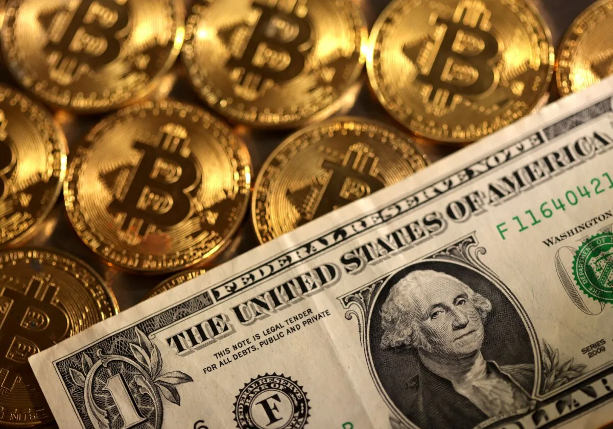 Representations of cryptocurrency bitcoin and the U.S. dollar in an illustration on Aug. 10, 2022. (Dado Ruvic/Reuters)