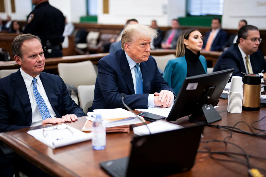 Former President Donald Trump (C) sits in the courtroom with attorneys Christopher Kise (L) and Alina Habba during his civil fraud trial at New York State Supreme Court in New York City on Oct. 18, 2023. (Doug Mills-Pool/Getty Images)