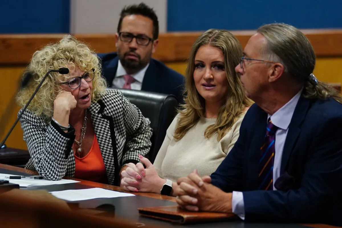 Jenna Ellis (C) reacts after reading a statement pleading guilty to a felony count of aiding and abetting false statements and writings at the Fulton County Courthouse in Atlanta on Oct. 24, 2023. (John Bazemore-Pool/Getty Images)