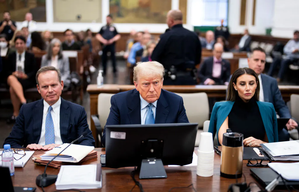 Former President Donald Trump (C) sits in the courtroom with attorneys Christopher Kise (L) and Alina Habba during his civil fraud trial at New York State Supreme Court in New York City on Oct. 18, 2023. (Doug Mills-Pool/Getty Images)