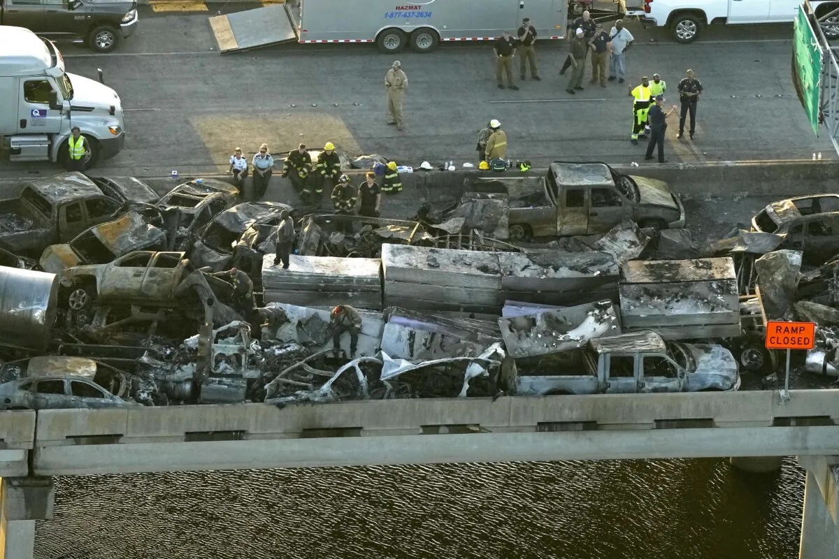 Responders near wreckage in the aftermath of a multi-vehicle pileup on I-55 in Manchac, La., on Oct. 23, 2023. (Gerald Herbert/AP Photo)