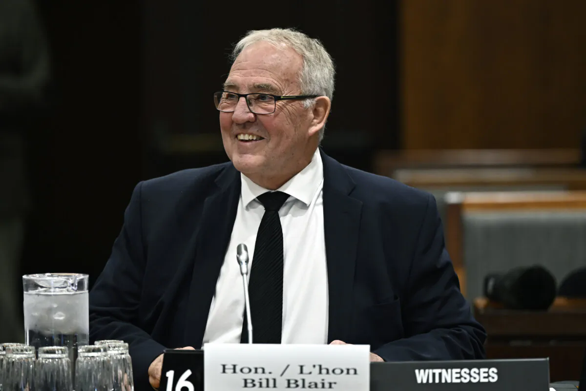 Minister of National Defence Bill Blair prepares to appear before the Standing Committee on Procedure and House Affairs on a question of privilege related to an intimidation campaign against the Member for Wellington-Halton Hills and other members, on Parliament Hill in Ottawa, on Oct. 24, 2023. (Justin Tang/The Canadian Press)