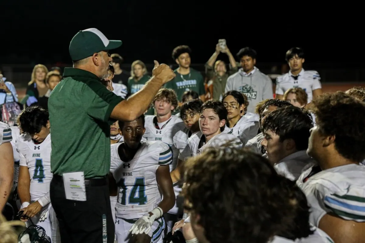 Irvine High School Football Coach Tom Ricci speaks to the team after its 20-12 victory over Beckman on Oct. 19, 2023. (Courtesy of Josh Harrell)