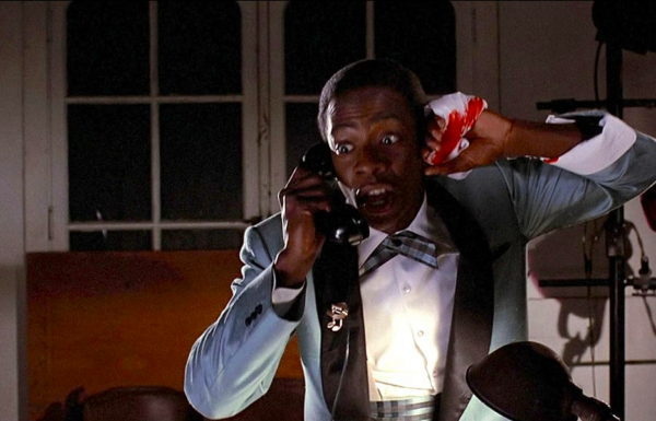 man with bleeding hand on the phone in BACK TO THE FUTURE