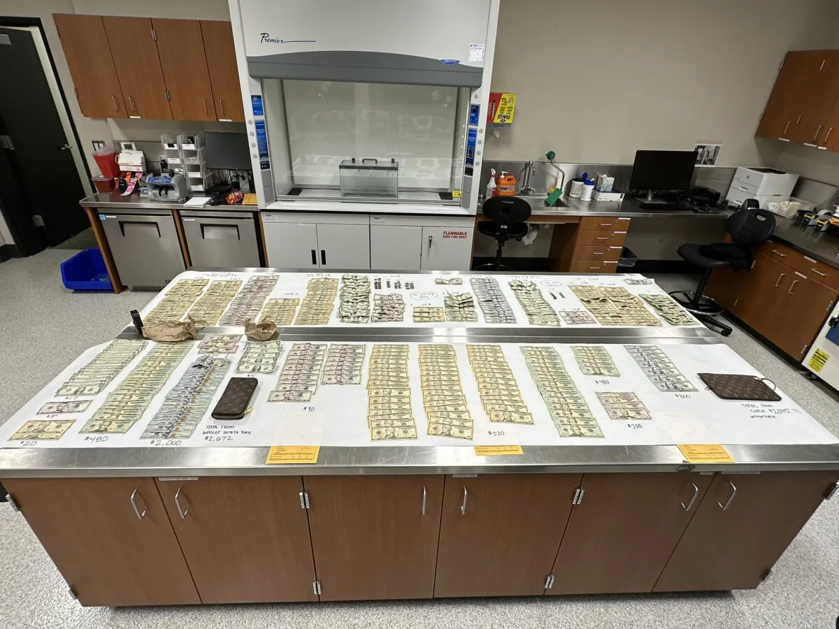 Over $8,000 in cash and designer merchandise were discovered during the arrest of a Home Depot employee for allegedly embezzling $1.2 million from the home improvement retailer in San Rafael, Calif., on Oct. 17, 2023. (Courtesy of San Rafael Police Department)