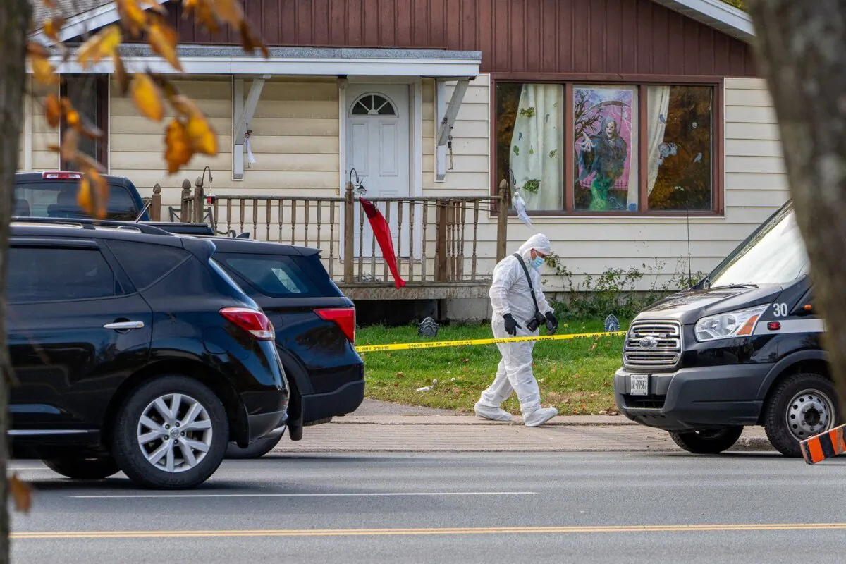 A police forensic unit attends a crime scene at a property on Second Line East, in Sault Ste. Marie, Ont., Oct. 24, 2023. (The Canadian Press/Bob Davies)