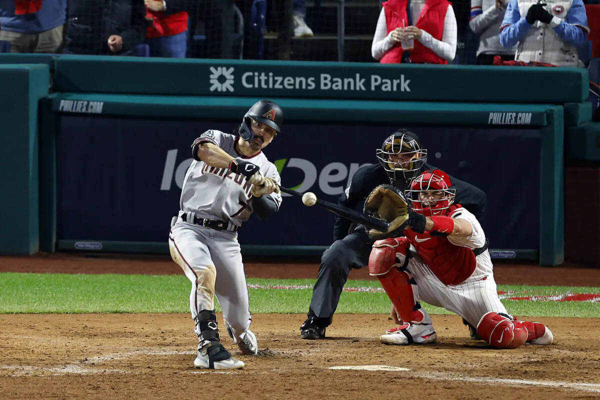 Corbin Carroll (7) of the Arizona Diamondbacks hits an RBI sacrifice fly against the Philadelphia Phillies during the seventh inning in Game Seven of the Championship Series in Philadelphia on Oct. 24, 2023. (Rich Schultz/Getty Images)