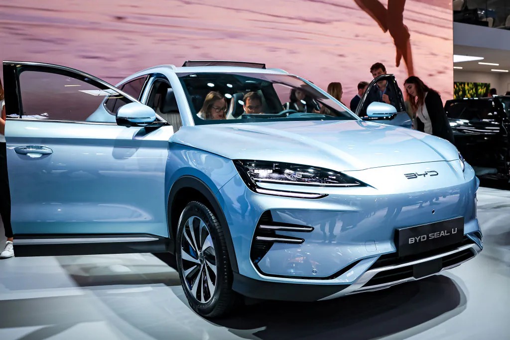 Visitors look at an BYD Seal U electric car at the IAA Mobility 2023 international motor show in Munich, Germany, on Sept. 6, 2023. (Leonhard Simon/Getty Images)