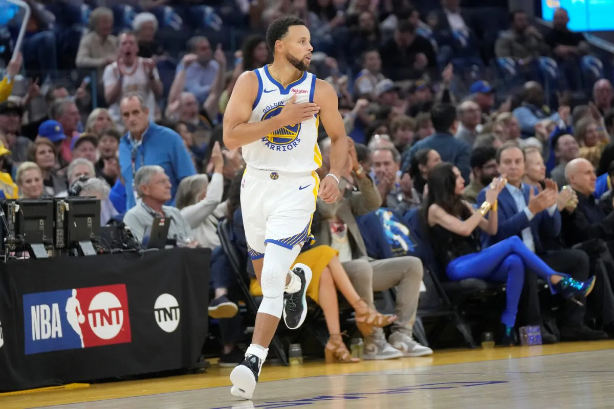 Golden State Warriors guard Stephen Curry gestures after making a 3-point basket against the Phoenix Suns during the first half of an NBA basketball game in San Francisco, on Oct. 24, 2023. (Jeff Chiu/AP Photo)