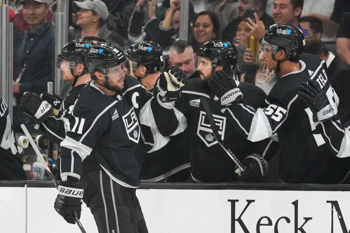 Los Angeles Kings center Anze Kopitar (11) celebrates with teammates after scoring during the first period of an NHL hockey game against the Arizona Coyotes in Los Angeles on Oct. 24, 2023. (Ashley Landis/AP Photo)