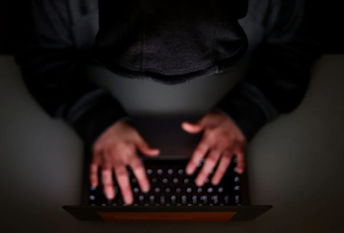 A person using a laptop on Mar. 30, 2020. (PA)