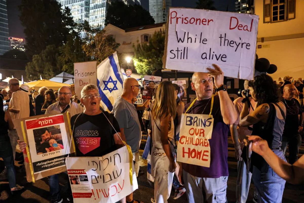 People attend a demonstration calling for the release of Israeli hostages held by the Hamas terrorist group after it attacked Israel on Oct. 7, near Azrieli Mall in Tel Aviv on Oct. 24, 2023. (Ahmad Gharabli /AFP via Getty Images)