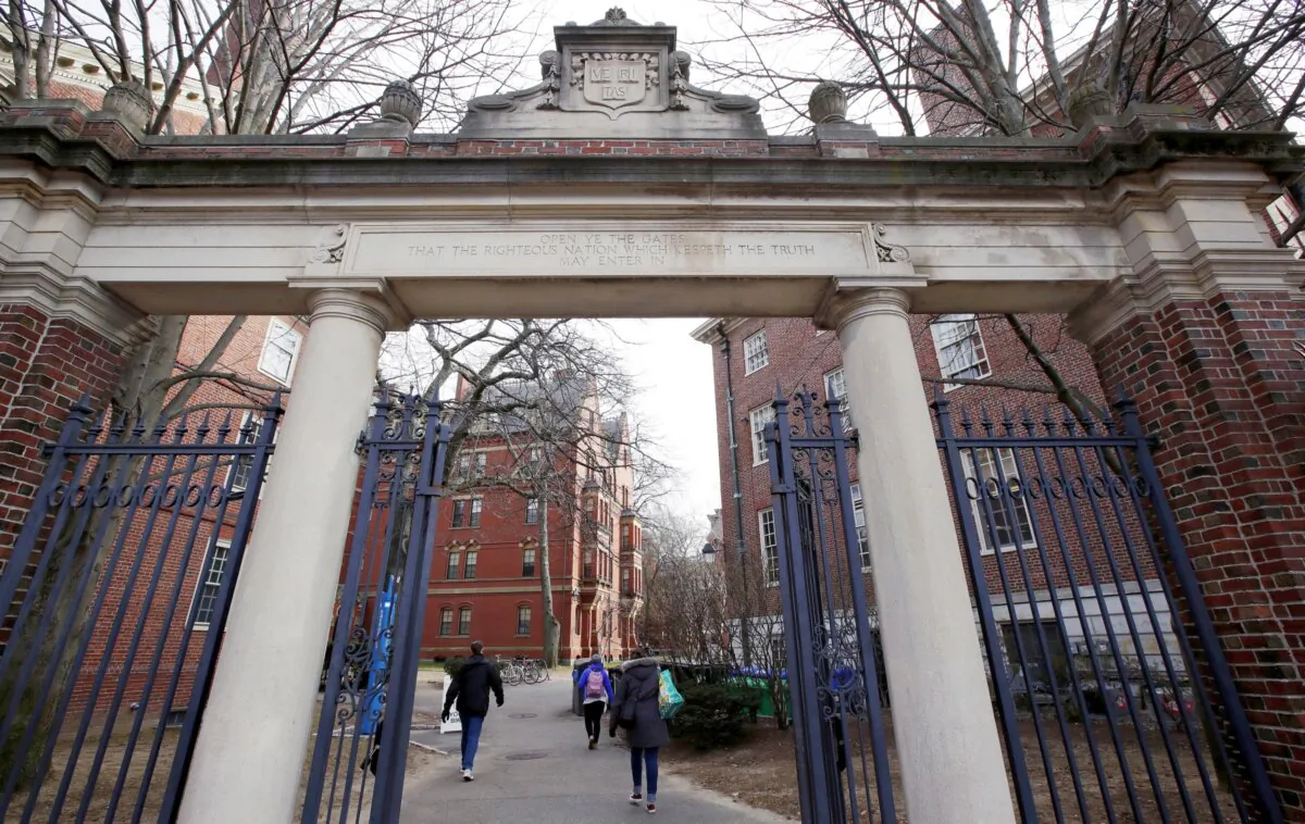 People walk through the gates leading to Harvard Yard, at Harvard University in Cambridge, Mass., on Dec. 13, 2018. (Charles Krupa/AP Photo)