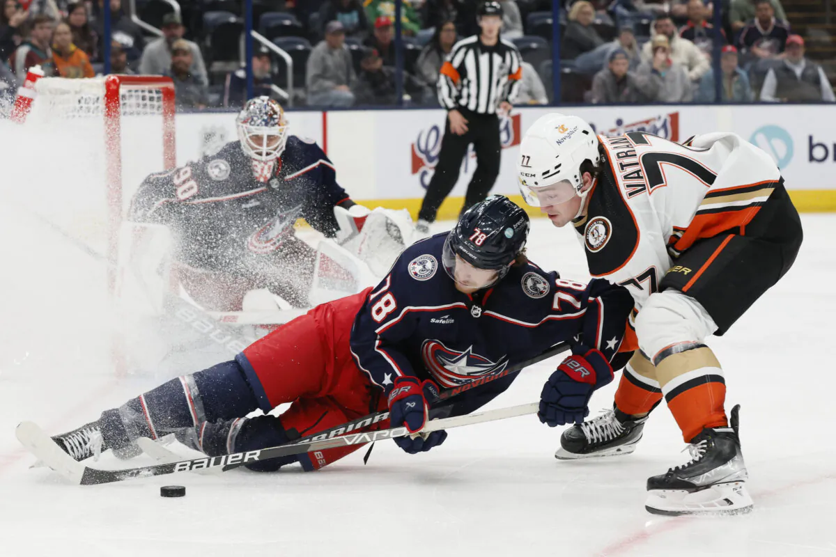 Anaheim Ducks' Frank Vatrano (R) and Columbus Blue Jackets' Damon Severson vie for the puck during the third period of an NHL hockey game in Columbus, Ohio, on Oct. 24, 2023. (Jay LaPrete/AP Photo)