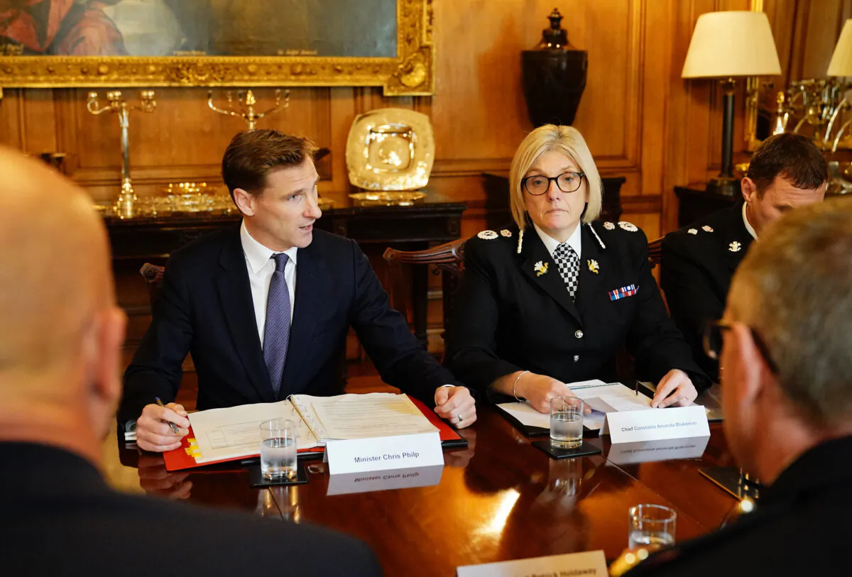Crime and Policing Minister Chris Philp (2L) hosts senior figures in policing and 13 of the UK’s biggest retailers in Downing Street to set out a joint plan of action to tackle shoplifting, in London, on Oct. 23, 2023. (Aaron Chown - WPA Pool/Getty Images)