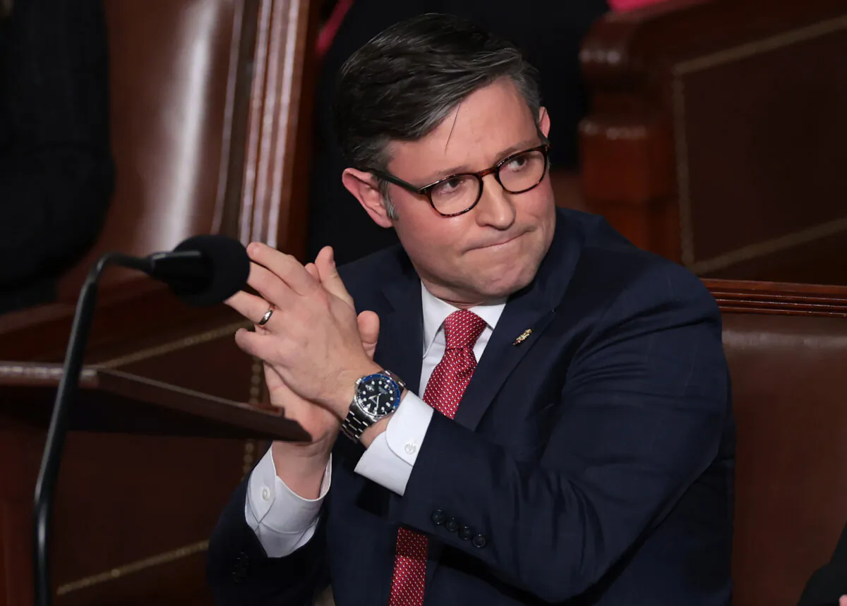 Rep. Mike Johnson (R-La.) applauds alongside fellow lawmakers as the House of Representatives holds an election for a new Speaker of the House at the U.S. Capitol in Washington on Oct. 25, 2023. (Win McNamee/Getty Images)