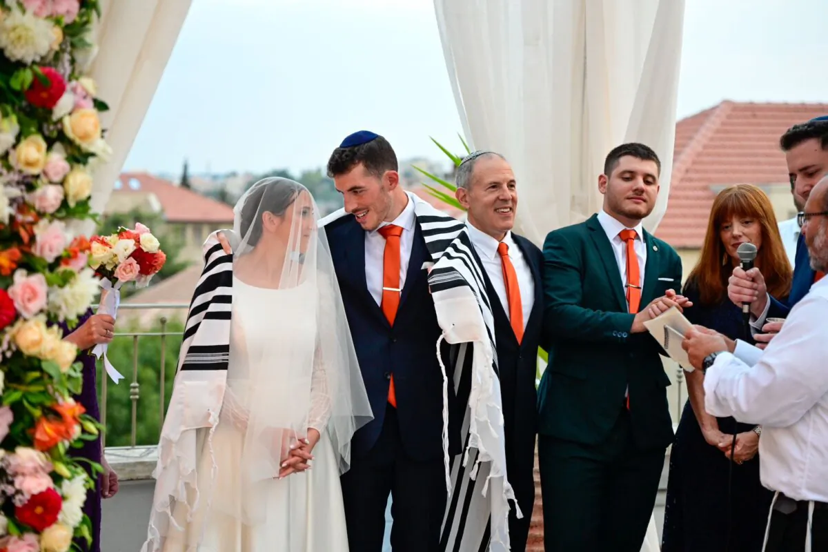Aaron and Tamar Greene were married on a Jerusalem rooftop in Israel on Oct. 9, 2023, two days after Hamas terrorists massacred 1,200 Israelis and foreigners. (Courtesy of Aaron Greene)
