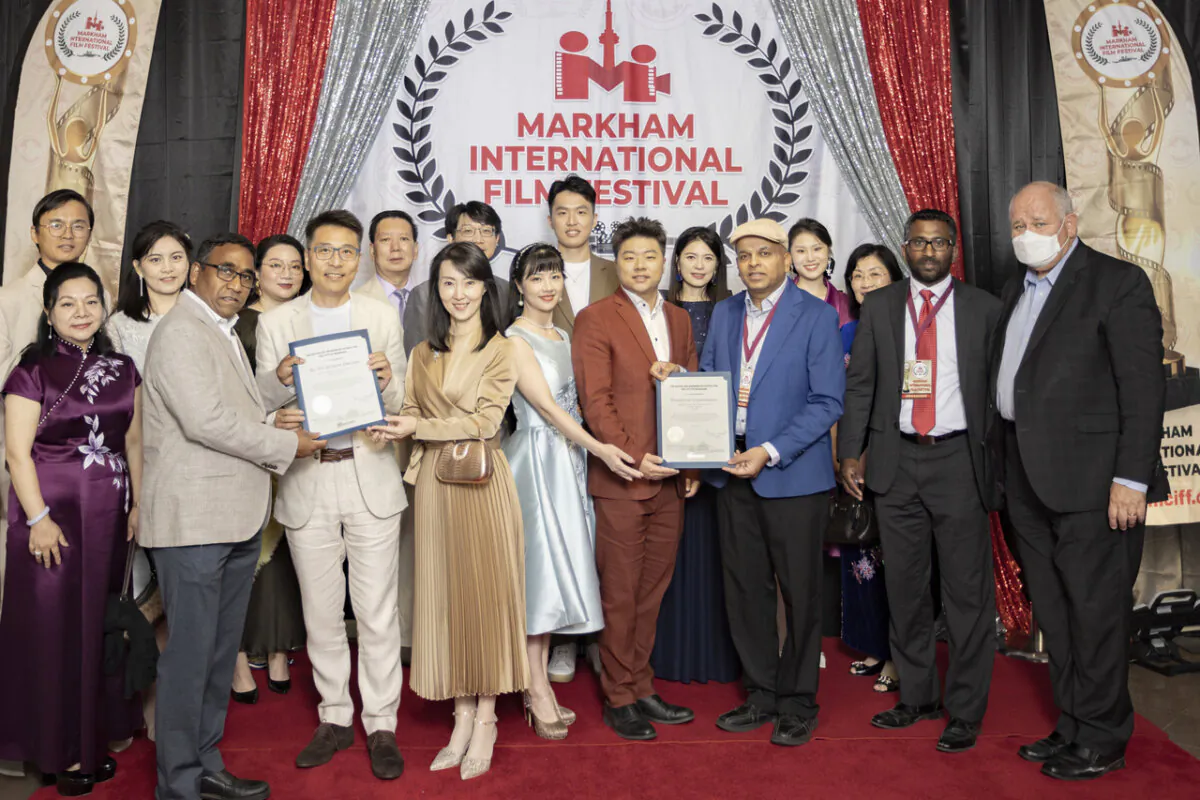Markham Mayor Frank Scarpitti (R) poses with members of New Century Films and festival organizers at the Markham International Film Festival in Markham, Ont., on July 15, 2023. (Courtesy of New Century Films) 