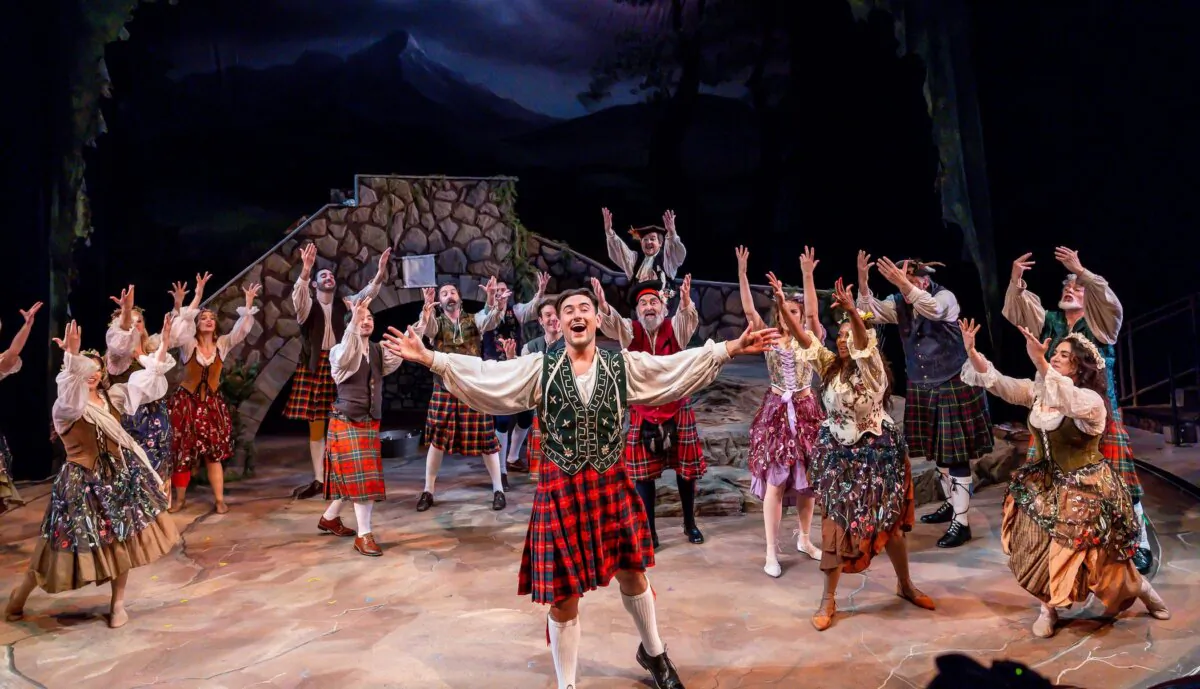 Luke Nowakowski (center foreground) and cast members, “Brigadoon.” (Brett Beiner)