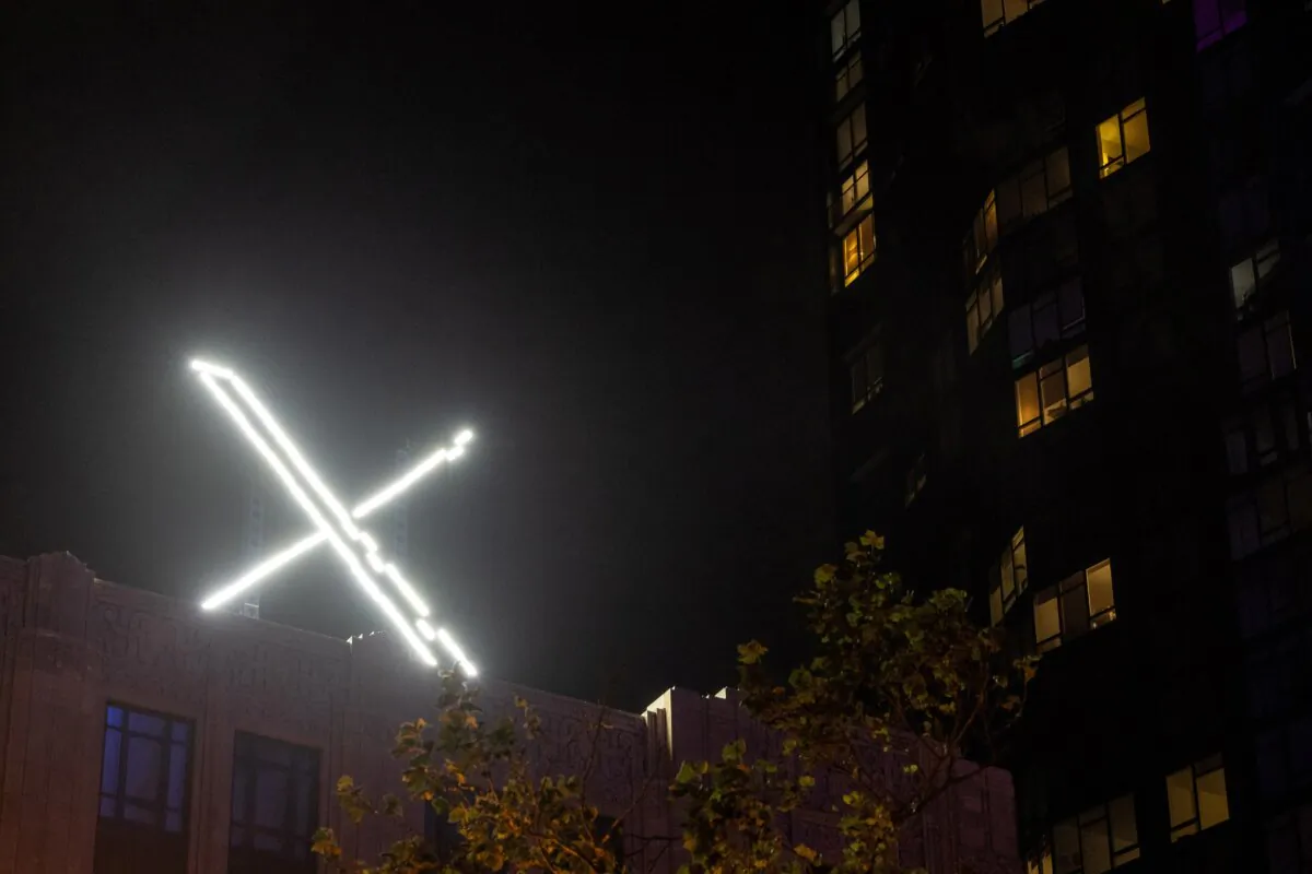 'X' logo on the top of the headquarters of the messaging platform X, formerly known as Twitter, in downtown San Francisco on July 30, 2023. (Carlos Barria/Reuters)