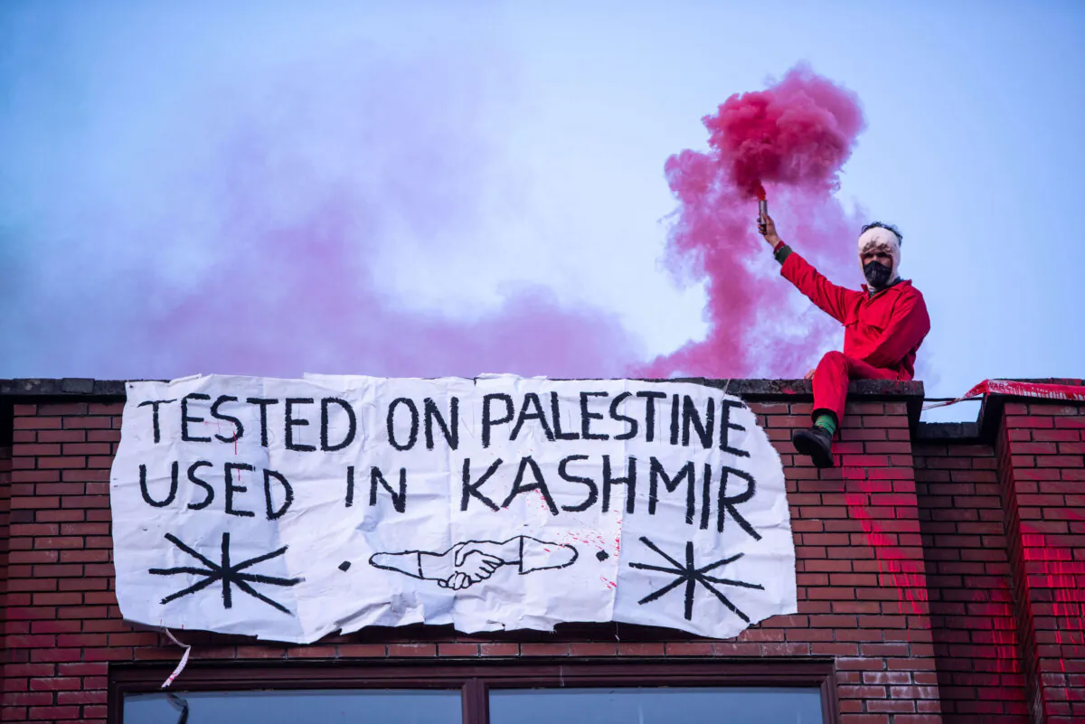 Palestine Action protesters in Oldham, where at least five people have been arrested after protests at a factory which pro-Palestinian activists claim supplies weapons to Israel, on April 13, 2021. (PA Media)