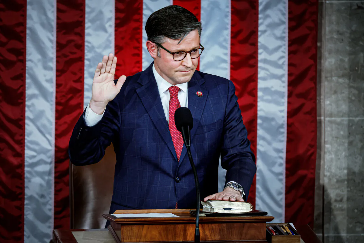 Newly elected Speaker of the House Mike Johnson (R-La.) takes his oath of office at the U.S. Capitol in Washington on Oct. 25, 2023. After a contentious nominating period, Mr. Johnson was voted in to succeed former Speaker Kevin McCarthy (R-Calif.), who was ousted on Oct. 4. (Chip Somodevilla/Getty Images)