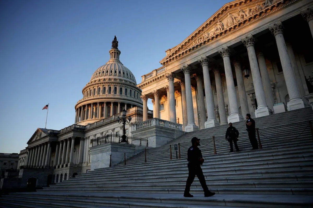 U.S. Capitol Police stand watch on the East Front of the Capitol at sunrise in Washington, D.C., on Oct. 25, 2023. (Chip Somodevilla/Getty Images)